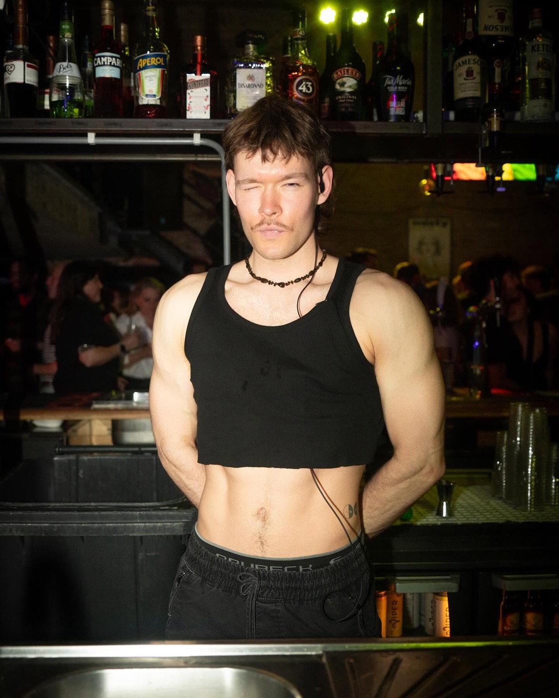 The bartender behind the bar
